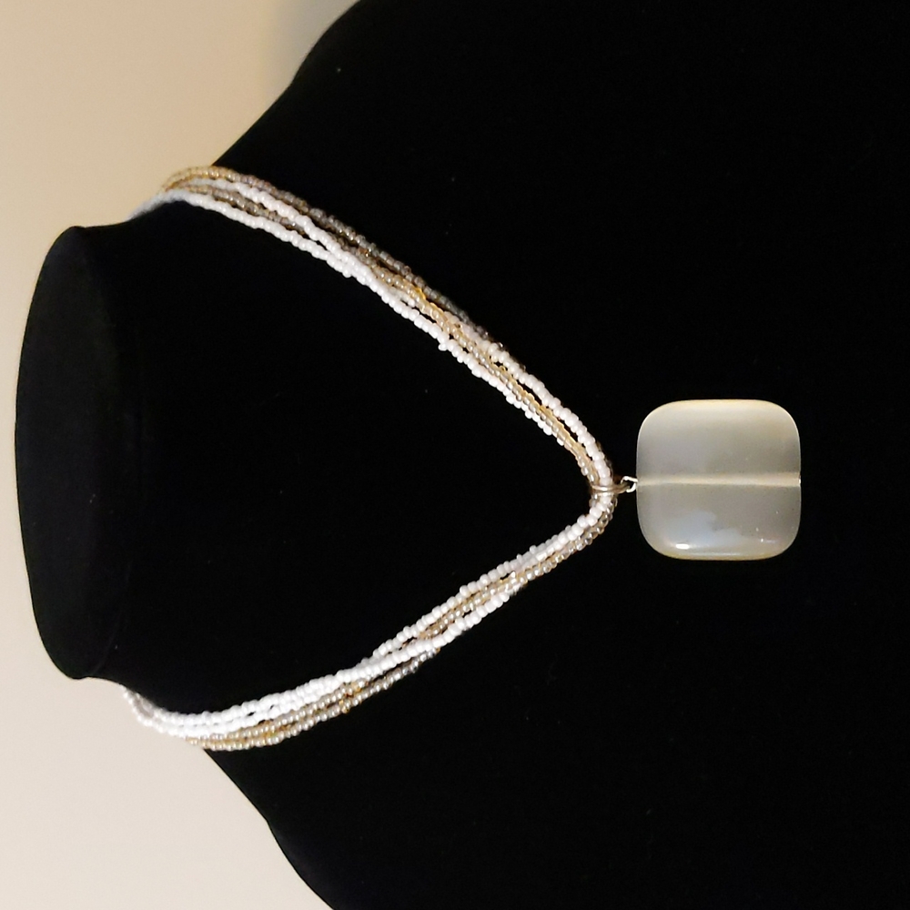 15" necklace with gold and white seed beads and square stone pendant.